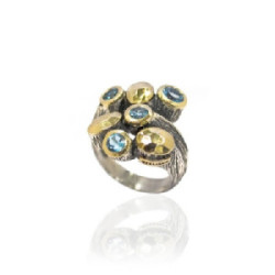 Anillo en plata de ley 925 y oro de 9k con topacio azul